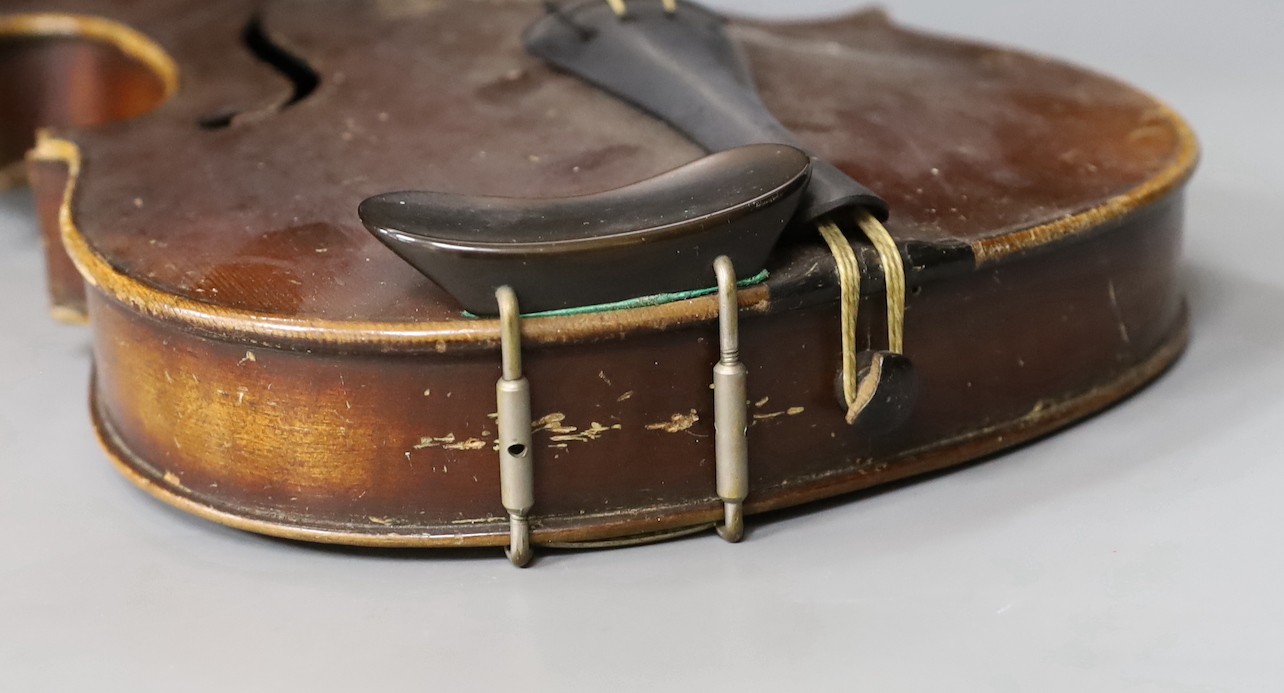 A cased German violin, labelled Stradivarius and dated 1886, back measures 36cm excl button